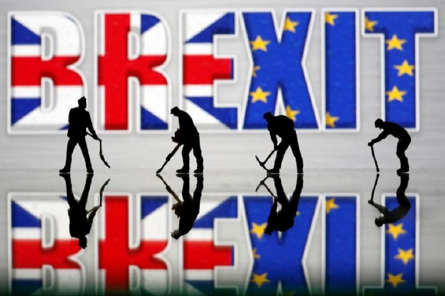 Small toy figures are seen in front of a Brexit logo in this illustration picture, March 30, 2019 — Reuters/Files