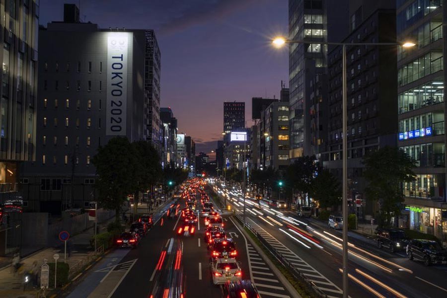 Streaks of lights from cars passing through in Tokyo –AP photo