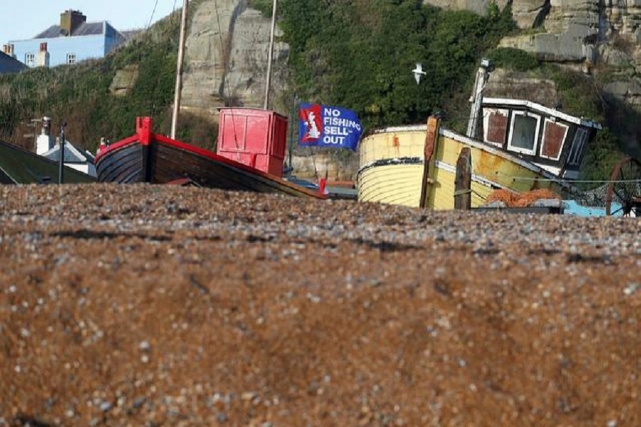 A flag with a slogan supporting the UK fishing industry is seen on the beach in Hastings, Britain, December 20, 2020 — Reuters/Files