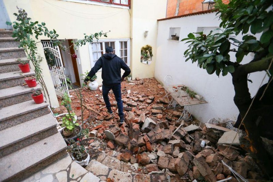 A man walks over debris after an earthquake, in Zagreb, Croatia December 29, 2020. REUTERS/Antonio Bronic