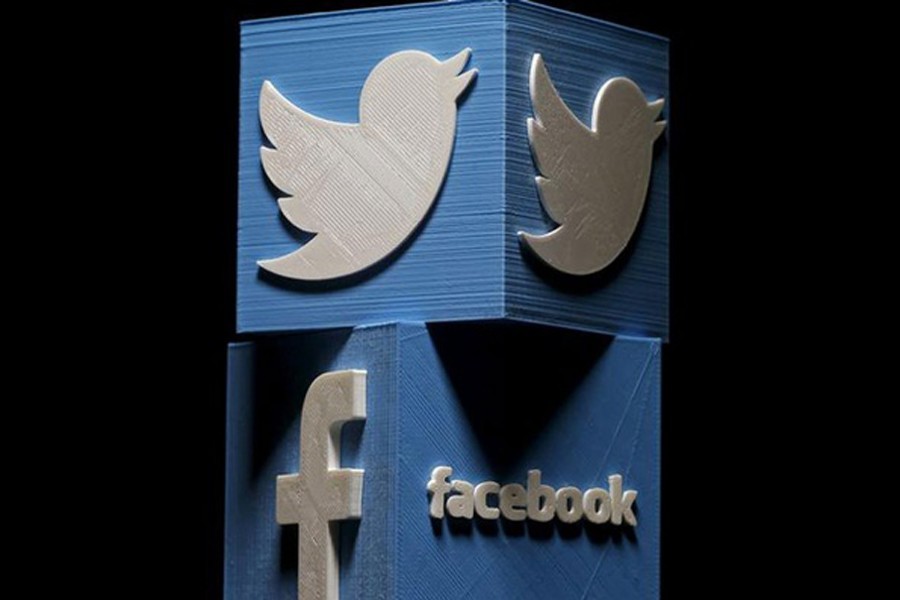 A 3D printed Facebook and Twitter logo seen in the undated Reuters illustration