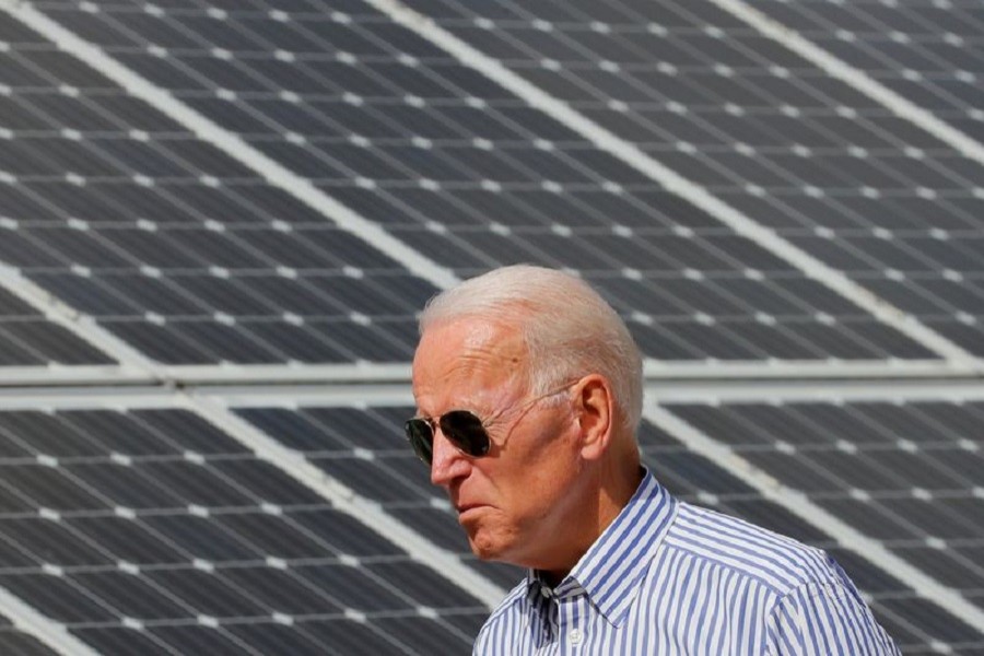 Democratic 2020 US presidential candidate and former Vice President Joe Biden walks past solar panels while touring the Plymouth Area Renewable Energy Initiative in Plymouth, New Hampshire, US, June 4, 2019 — Reuters/Files