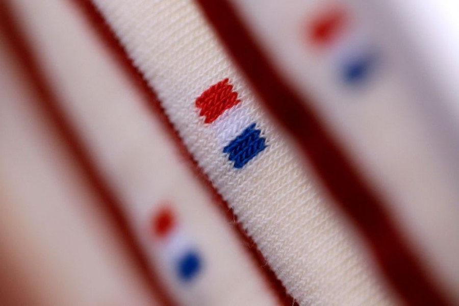 French flag is seen on a pair of socks displayed at the "Made In France" fair in Paris on November 10, 2013 — Reuters/Files