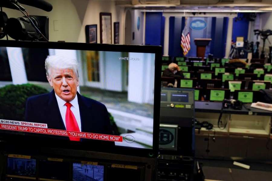 US President Donald Trump is seen making remarks on a television monitor from the White House Briefing Room, after his supporters interrupted the certification by the US Congress of the results of the 2020 US presidential election at the Washington Capitol, in Washington, US, January 6, 2021 — Reuters/Files