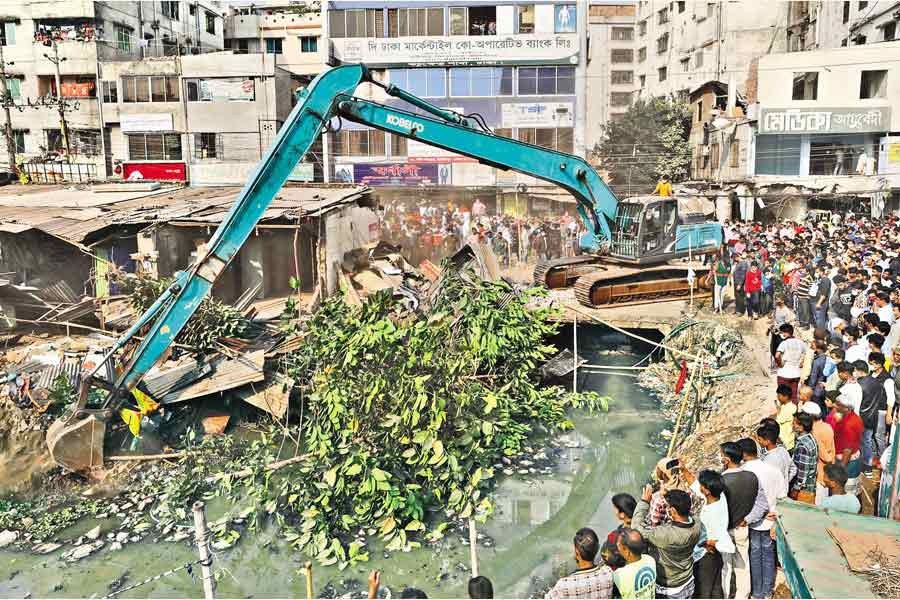 Dhaka North City Corporation knocks down illegal structures on the bank of Ibrahimpur canal at Mirpur in the city during a drive against encroachers recently— FE file photo