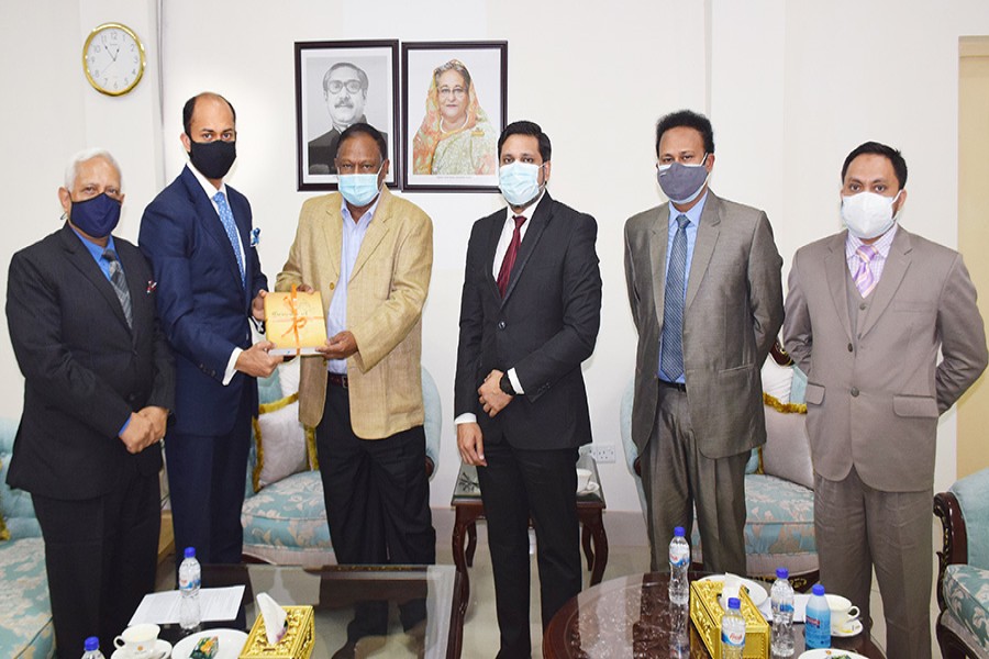 DCCI President Rizwan Rahman, Secretary General Afsarul Arifeen and other officials during a meeting with Commerce Minister Tipu Munshi in the city on Monday