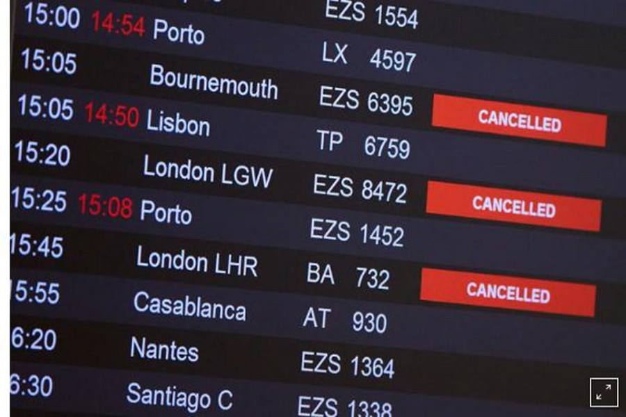 FILE PHOTO: Flights from Britain are announced cancelled at Cointrin airport, the day the Swiss government imposed a 10 days quarantine for travellers who have entered from Britain, during the outbreak of the coronavirus disease (COVID-19) in Geneva, Switzerland, December 21, 2020.  REUTERS/Denis Balibouse/File Photo