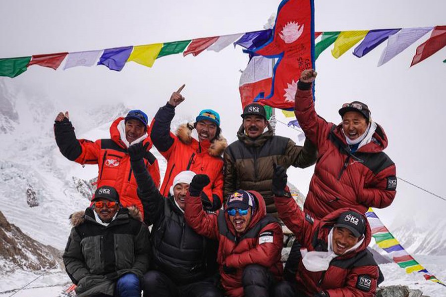 Nirmal "Nims" Purja, Dawa Tenji Sherpa (team MG), Mingma G, Dawa Temba Sherpa and Pem Chiri Sherpa, Mingma David Sherpa, Mingma Tenzi Sherpa, Nimsdai Purja and Gelje Sherpa are seen during the Puja ceremony before the winter attack on K2, Pakistan on January 5, 2021 — RED BULL CONTENT POOL/Handout via REUTERS