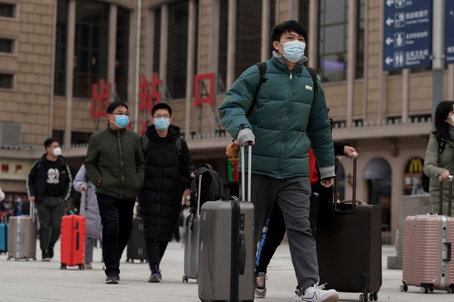 China, WHO should have acted quicker to stop pandemic, experts say