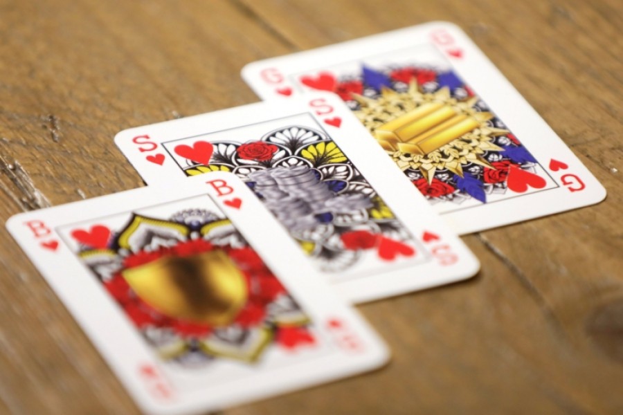 King toppled from throne of card