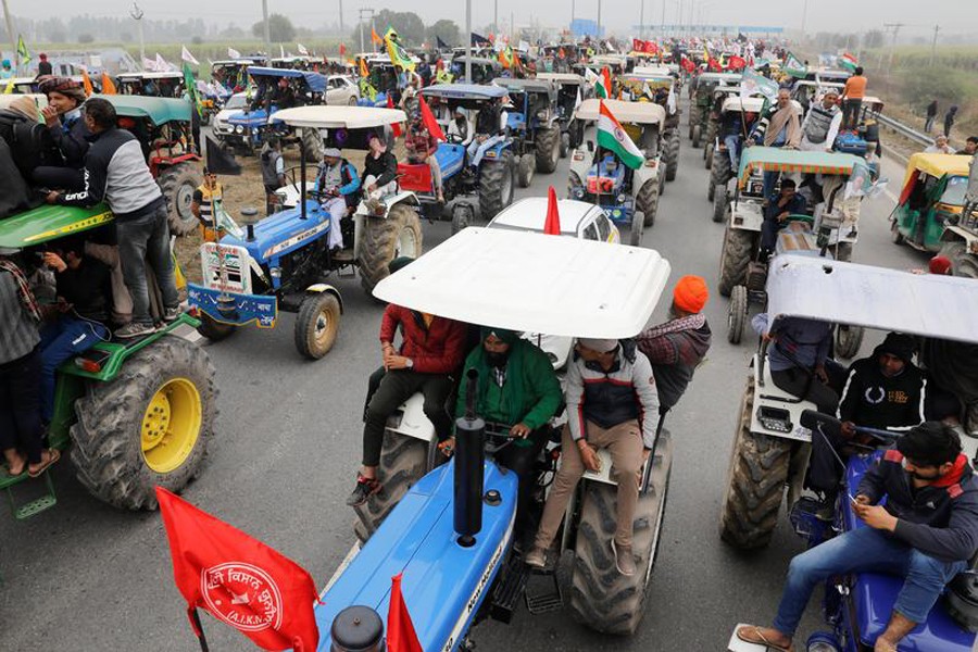 Farmers participate in a tractor rally to protest against the newly passed farm bills, on a highway on the outskirts of New Delhi, India on January 7, 2021 — Reuters/Files