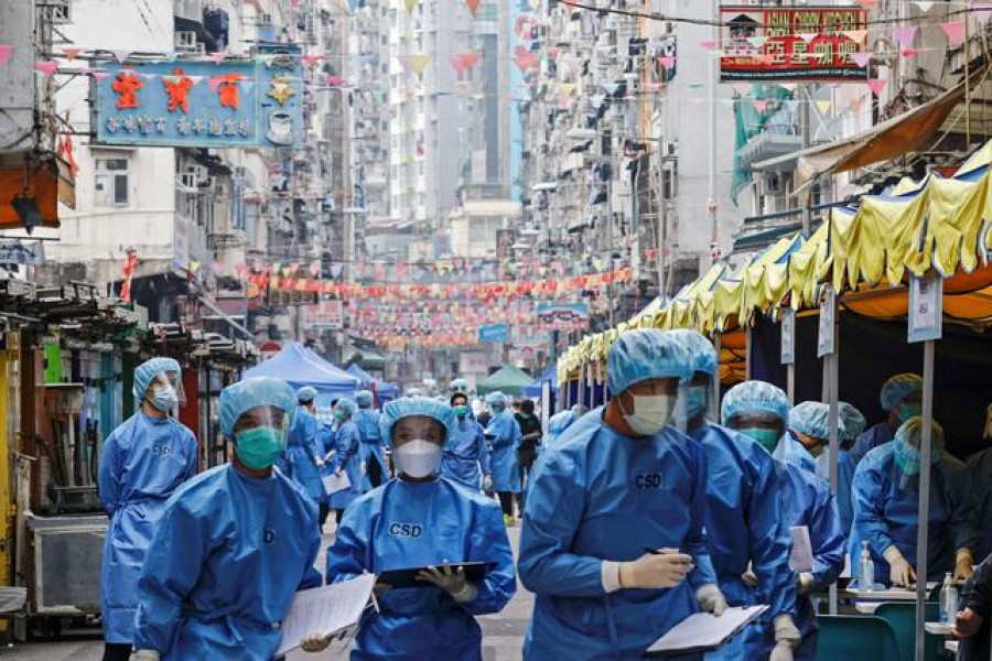 Health workers are seen in protective gear inside a locked down portion of the Jordan residential area to contain a new outbreak of the coronavirus disease (Covid-19), in Hong Kong, China on January 23, 2021 — Reuters photo