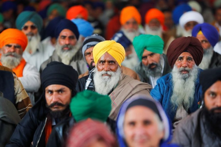 Farmers listen to a speaker during a protest against the farm laws at Singhu border near New Delhi, India, January 30, 2021. REUTERS