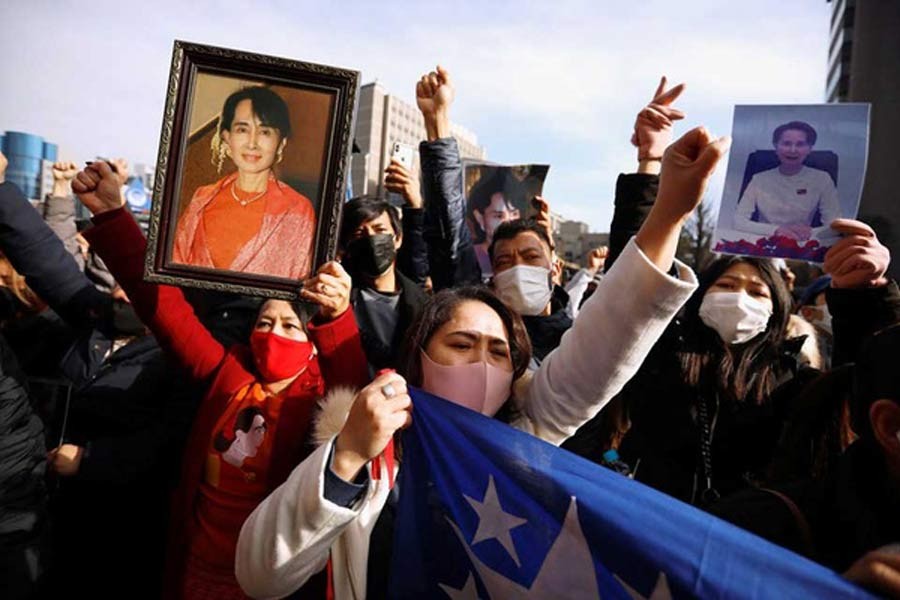 Myanmar protesters residing in Japan hold photos of Aung San Suu Kyi as they rally against Myanmar's military after seizing power from a democratically elected civilian government and arresting its leader Aung San Suu Kyi, at United Nations University in Tokyo on Monday –Reuters Photo
