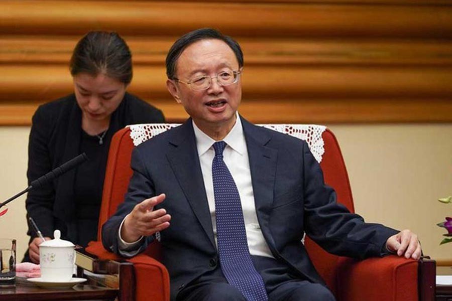 China's top diplomat urges Biden not to meddle in internal affairs