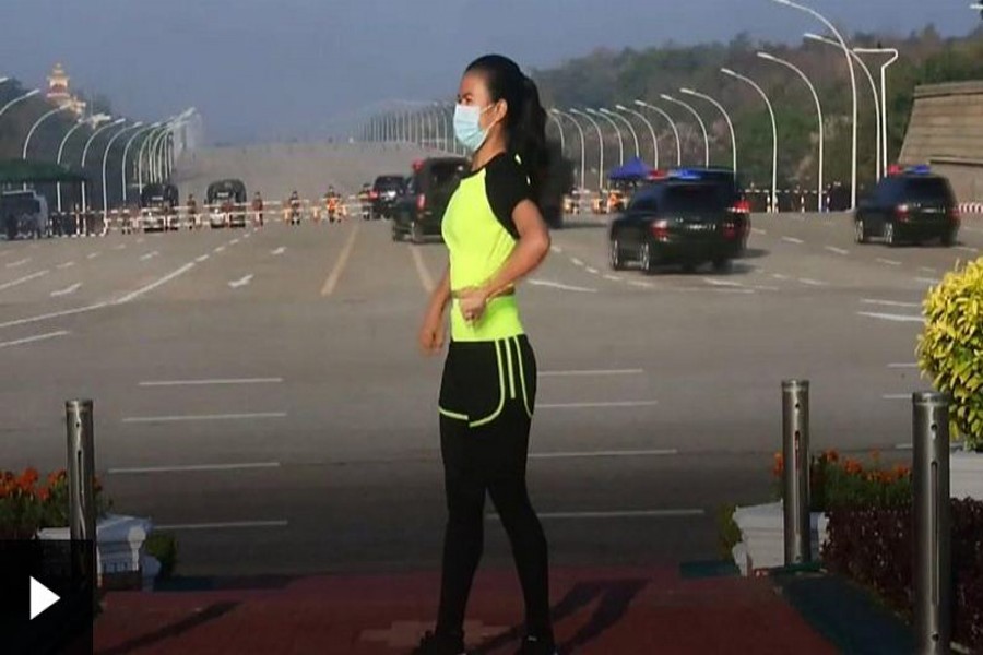 This oblivious aerobics instructor caught a moment of Myanmar's history on camera
