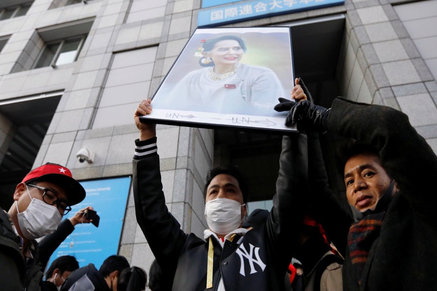 Protesters from Myanmar residing in Japan hold a portrait of leader Aung San Suu Kyi at a rally against Myanmar's military after it seized power from a democratically elected civilian government and arrested Suu Kyi, at United Nations University in Tokyo, Japan February 1, 2021. REUTERS/Issei Kato/File Photo