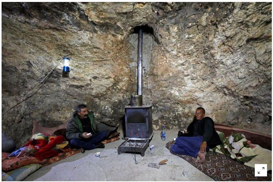 Palestinian man Barakat Mour sits in a hillside cave with his brother amid Palestinian worries about Israeli settler incursions into the property, in Masafer Yatta near Herbon, in the Israeli-occupied West Bank, January 28, 2021. Reporters/Mussa Qawasma