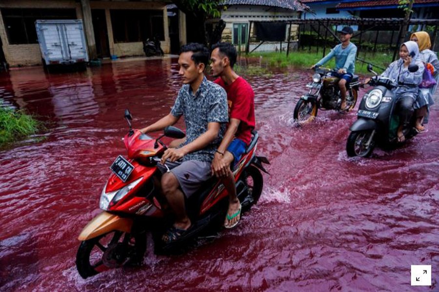 Indonesian village turns red as floods hit batik factory