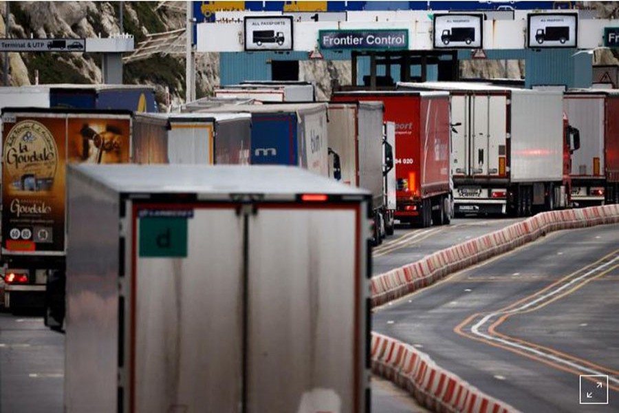 Lorries queue in at the border control of the Port of Dover, following the end of the Brexit transition period, in Dover, Britain, January 15, 2021. REUTERS/John Sibley/File Photo