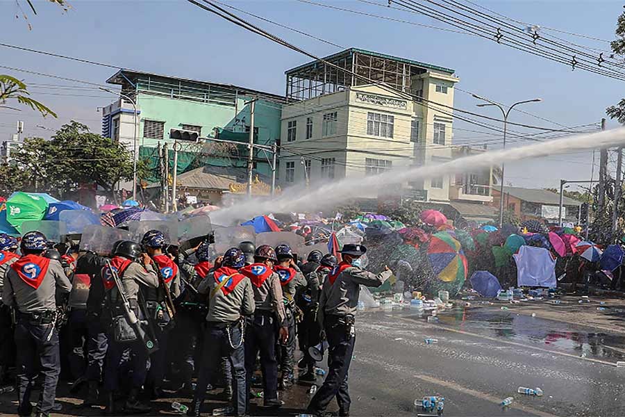 Police uses a water canon against demonstrators as they protest against the military coup and to demand the release of elected leader Aung San Suu Kyi, in Mandalay of Myanmar on Tuesday -Reuters photo