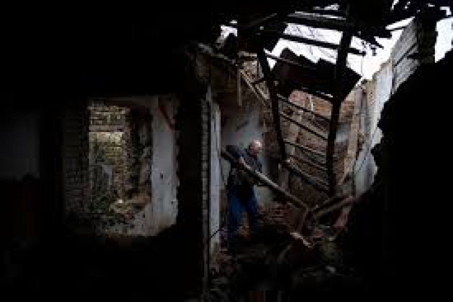 Zoltan Berki Sr, 55, searches for firewood in an old abandoned house in Ozd, Hungary, December 19, 2020. To Zoltan Berki Sr pollution means chest pain and coughs, but cold is a more imminent danger. "We collect what we find and take it home to burn," Berki said. "They heat up nicely, and we can't afford to buy anything." — Reuters/Files