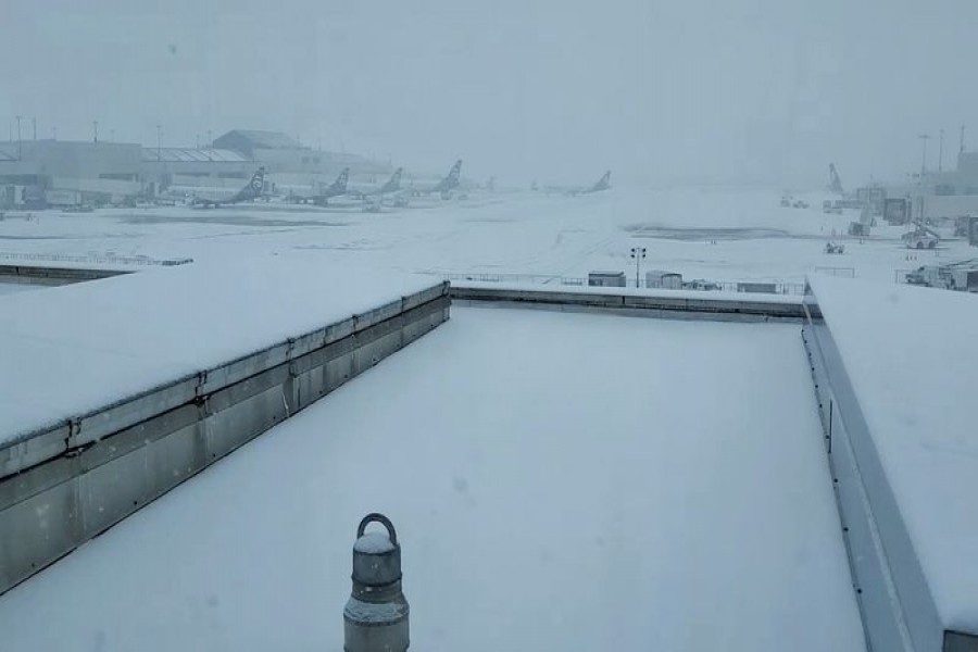 Airplanes are seen on the tarmac of Portland International Airport as it snows in Portland, Oregon, U.S. February 12, 2021, in this still image from video obtained from social media. PORT OF PORTLAND/PORTLAND INTERNATIONAL AIRPORT/via REUTERS