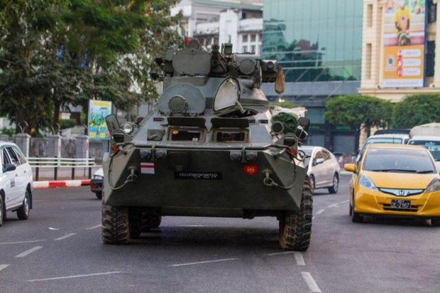 An armoured vehicle rides on a street during a protest against the military coup, in Yangon, Myanmar, February 14, 2021. REUTERS/Stringer