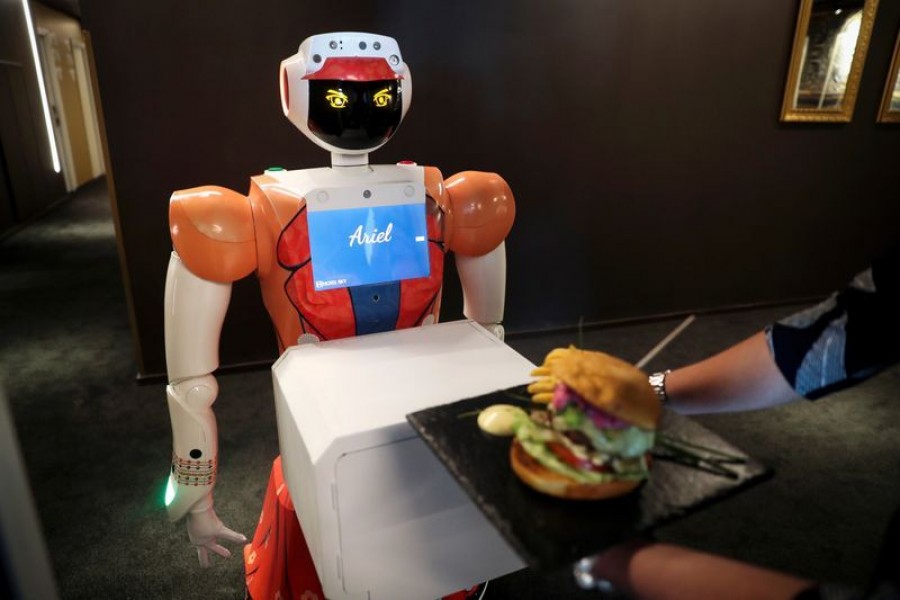 AI-powered robot Ariel delivers room service to a guest at the Hotel Sky, the first in Africa to use automated attendants, in Johannesburg on South Africa on February 9, 2021 — Reuters photo