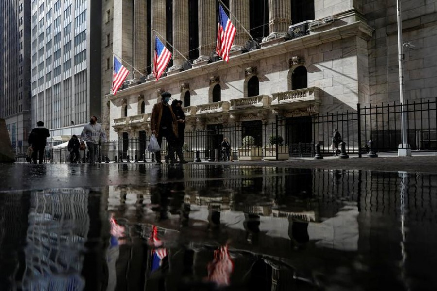 US flags fly out in front of the New York Stock Exchange (NYSE) is seen in New York, US, February 16, 2021. REUTERS/Brendan McDermid
