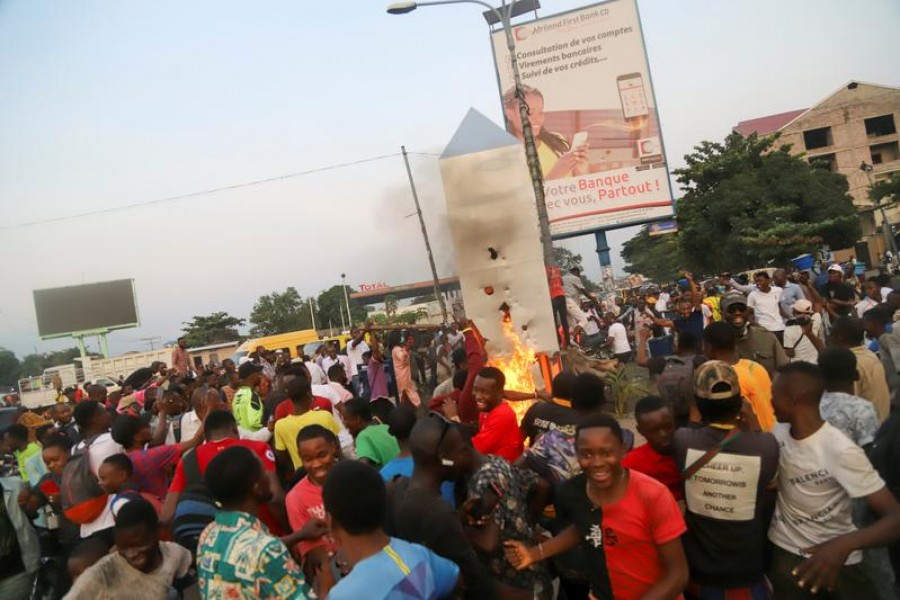 Residents set fire to the mysterious monolith that appeared in Kinshasa, Democratic Republic of Congo February 17, 2021 — Reuters