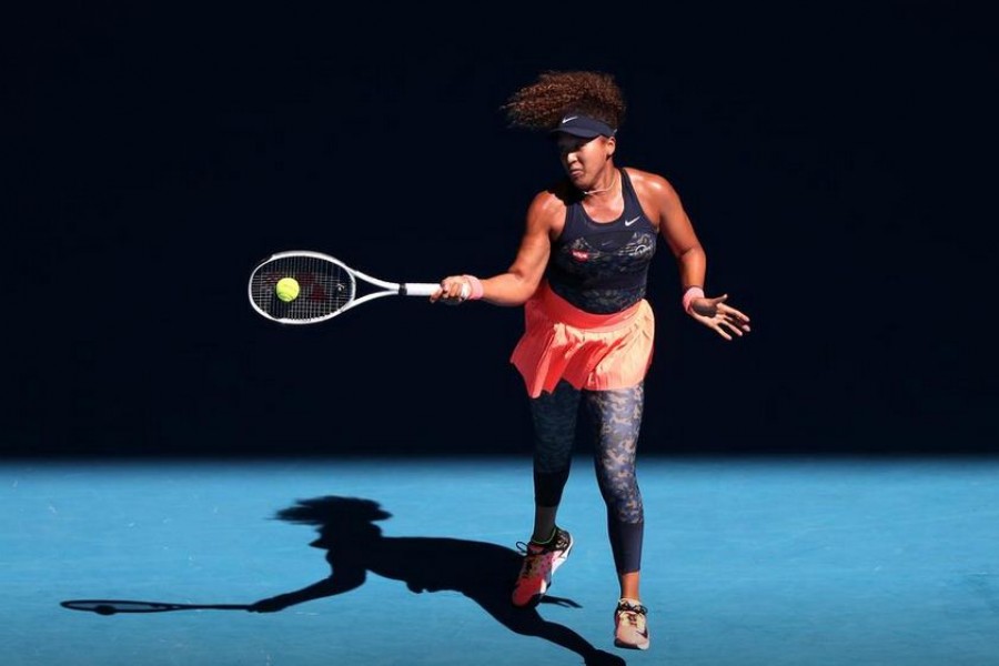 Tennis - Australian Open - Melbourne Park, Melbourne, Australia, February 18, 2021 Japan's Naomi Osaka in action during her semi final match against Serena Williams of the U.S. REUTERS/Asanka Brendon Ratnayake