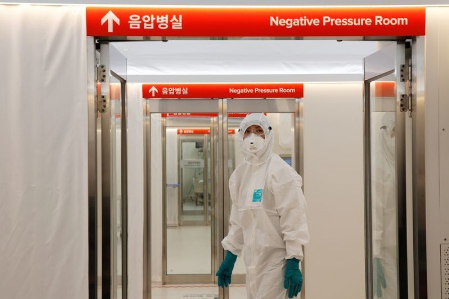 FILE PHOTO: A medical worker checks the doors inside the Mobile Clinic Module outside Korea Cancer Center Hospital in Seoul, South Korea, January 8, 2021. REUTERS/Heo Ran