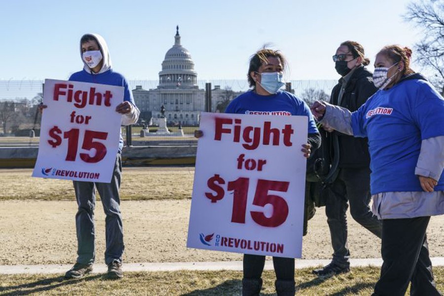 Activists appeal for a $15 minimum wage near the Capitol in Washington, Thursday, Feb. 25, 2021. (AP)