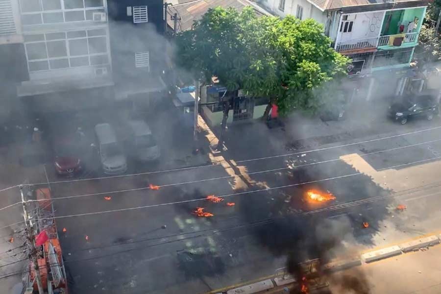 Smoke rise from burning objects during a protest in Yangon on Thursday, in this still image taken from a video. –Reuters Photo