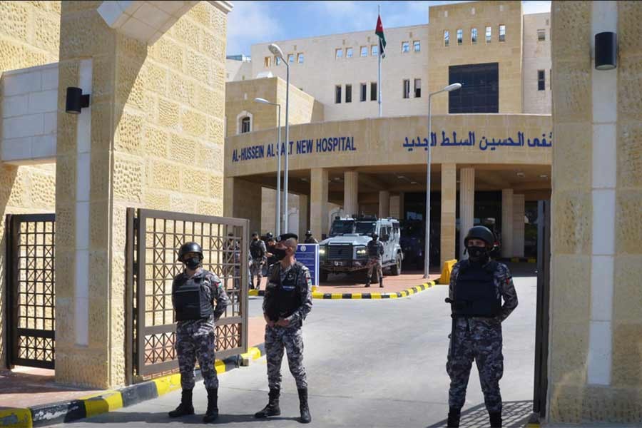 Gendarmerie officers stand guard at the gate of the new Salt government hospital in the city of Salt in Jordan on Saturday -Reuters Photo