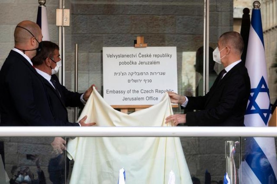 FILE PHOTO: Czech Prime Minister Andrej Babis, Israeli Foreign Minister Gabi Ashkenazi and Israeli Public Security Minister Amir Ohana unveil a sign during an inauguration ceremony of a Czech diplomatic representation in Jerusalem March 11, 2021. Sebastian Scheiner/Pool via REUTERS