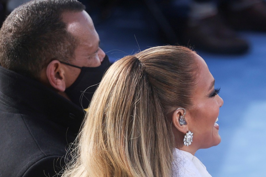 Singer Jennifer Lopez smiles next to Alex Rodriguez during the inauguration of Joe Biden as the 46th President of the United States on the West Front of the U.S. Capitol in Washington, U.S., January 20, 2021. REUTERS/Jonathan Ernst/Pool