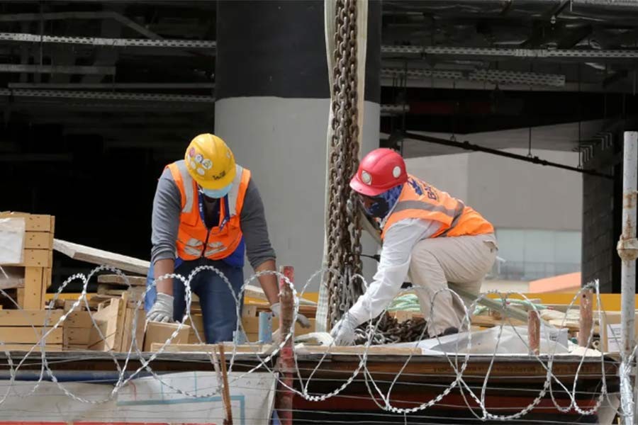 Foreign workers wearing protective face masks and gloves work at a construction site, following the outbreak of the coronavirus disease in Riyadh –Reuters file photo
