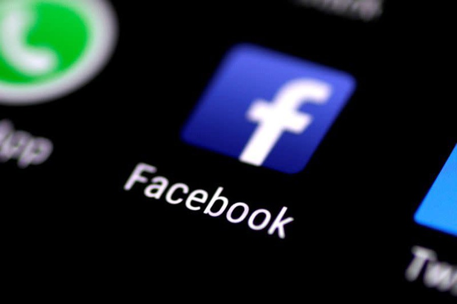 The Facebook application is seen on a phone screen on August 3, 2017 — Reuters/Files