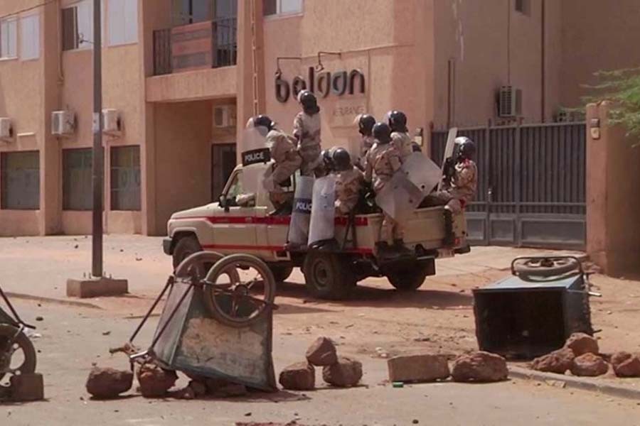 Riot policemen drive towards a group of protesters at a makeshift checkpoint, a day after opposition presidential candidate Mahamane Ousmane rejected election results that gave his opponent Mohamed Bazoum a majority of the votes, in Niamey, Niger, on February 24 –Reuters file photo