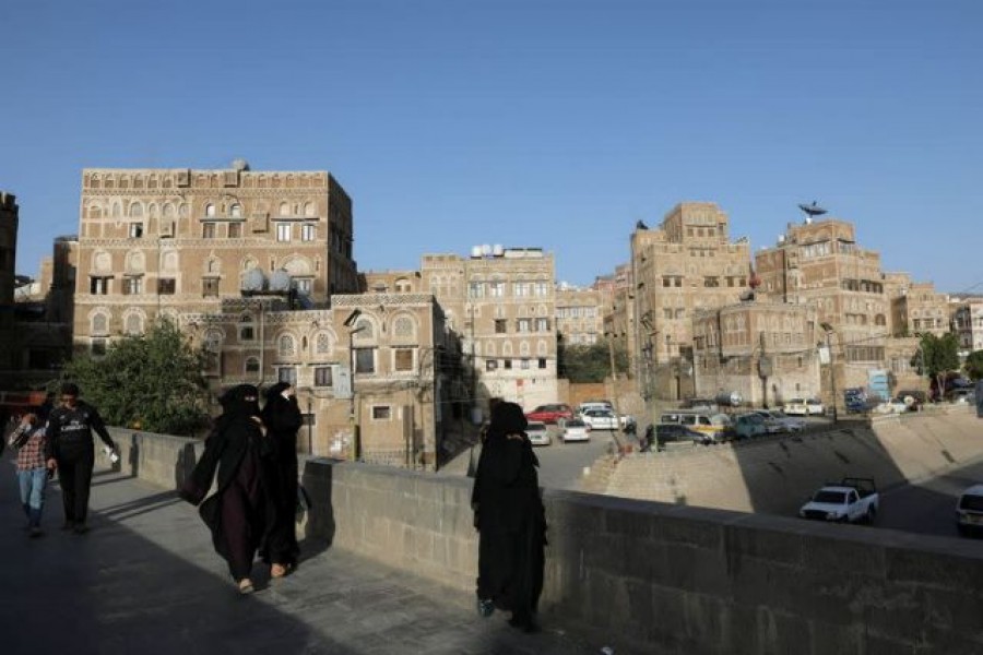 People walk in the old quarter of Sanaa, Yemen, March 22, 2021 — Reuters