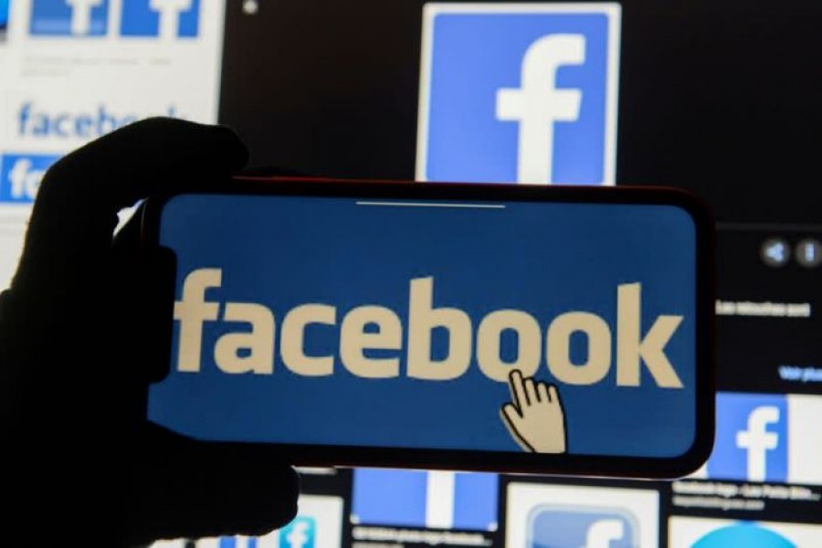 The Facebook logo is displayed on a mobile phone in this picture illustration taken December 2, 2019. REUTERS