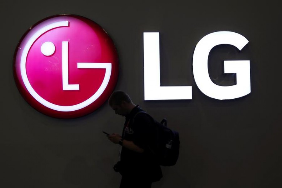 A man walks past an LG logo at the Mobile World Congress in Barcelona, Spain on February 27, 2018 — Reuters/Files