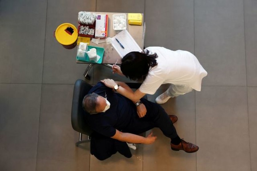 A medical worker vaccinates a man against the coronavirus disease (Covid-19) as Israel kicks off a coronavirus vaccination drive, at Tel Aviv Sourasky Medical Center (Ichilov Hospital) in Tel Aviv, Israel on December 20, 2020 — Reuters/Files