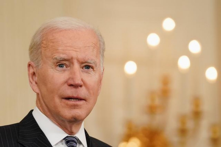 FILE PHOTO: US President Joe Biden delivers remarks on the state of the coronavirus disease (COVID-19) vaccinations from the State Dining Room at the White House in Washington, D.C., US, April 6, 2021. REUTERS/Kevin Lamarque