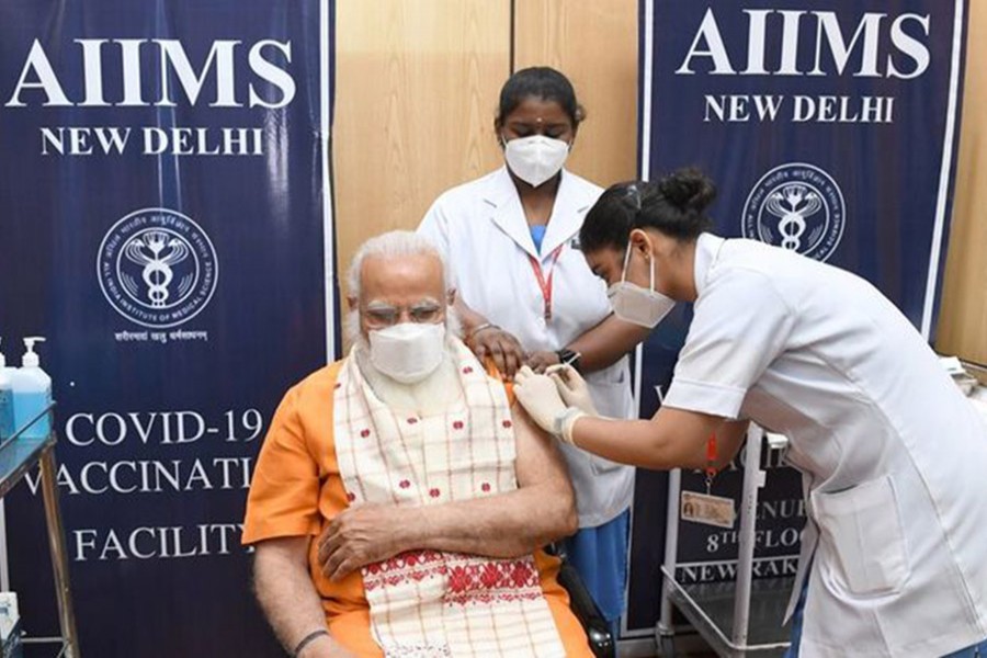 India's Modi rejects calls to widen vaccine access as infections hit record