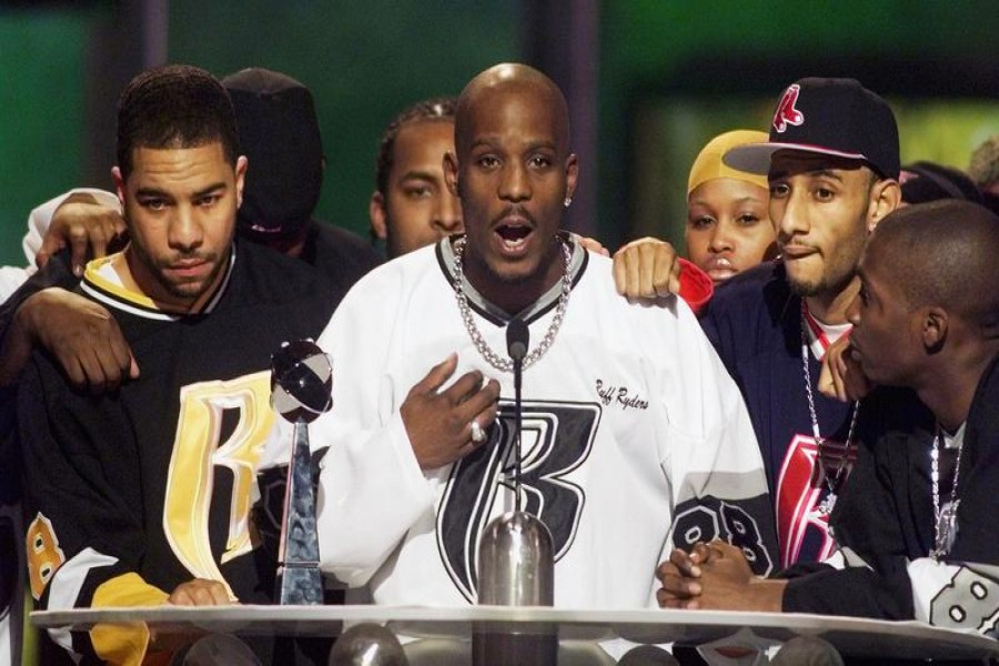 FILE PHOTO: Rapper DMX (C) offers a prayer after winning the R&B Albums Artist of the Year award at the Billboard Music Awards show at the MGM Grand Hotel in Las Vegas December 8, 1999. REUTERS/Ethan Miller/File Photo