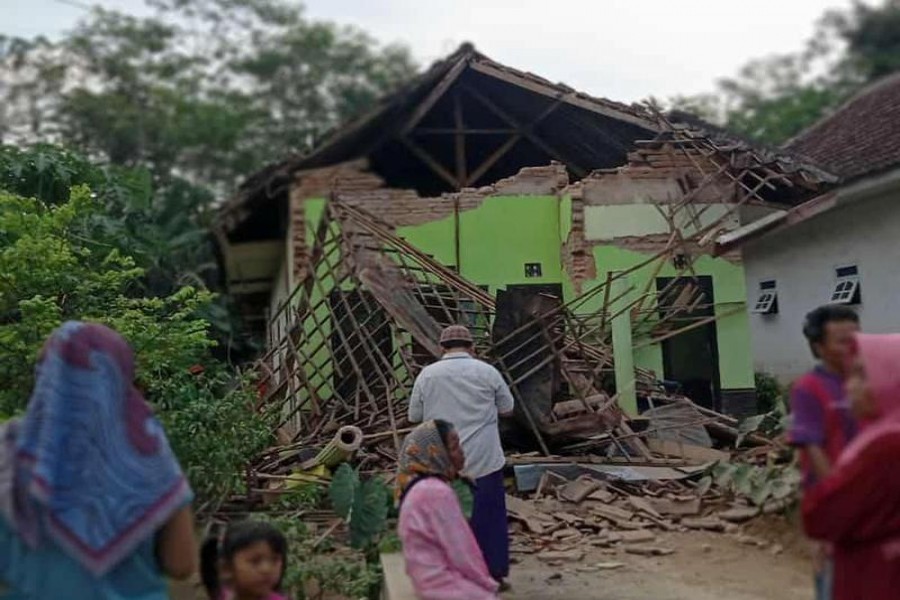 A damaged house affected by an earthquake of magnitude 5.9 struck in the ocean 91 km (57 miles) south-southeast of Blitar, is pictured in Malang, East Java province, Indonesia April 10, 2021, in this photo taken by Antara Foto/via Reuters.