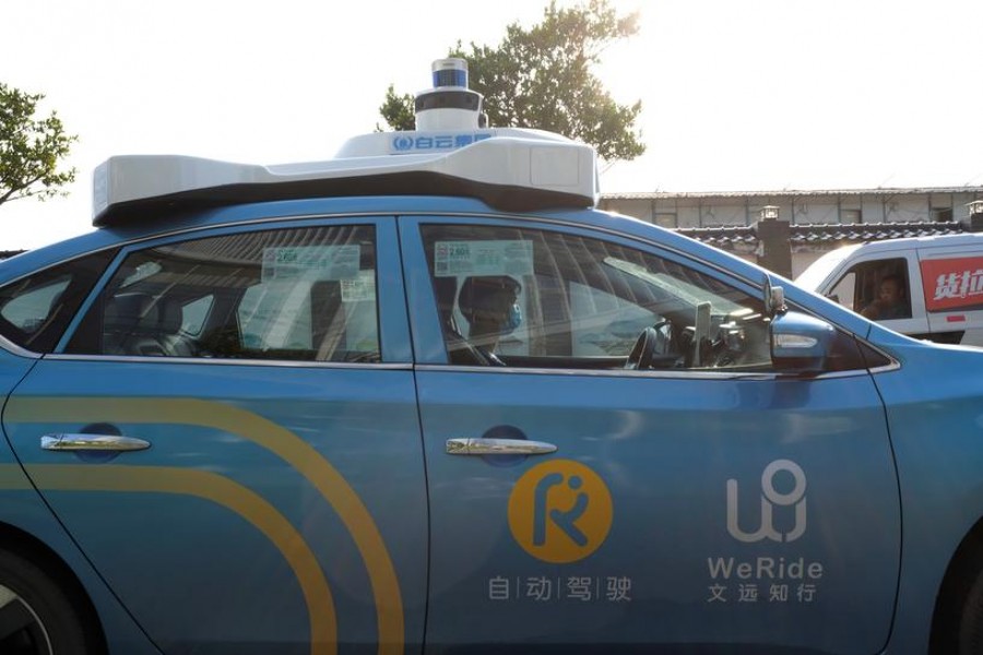 FILE PHOTO: A WeRide autonomous taxi is seen in Guangzhou, Guangdong province, China May 15, 2020. REUTERS/Yilei Sun